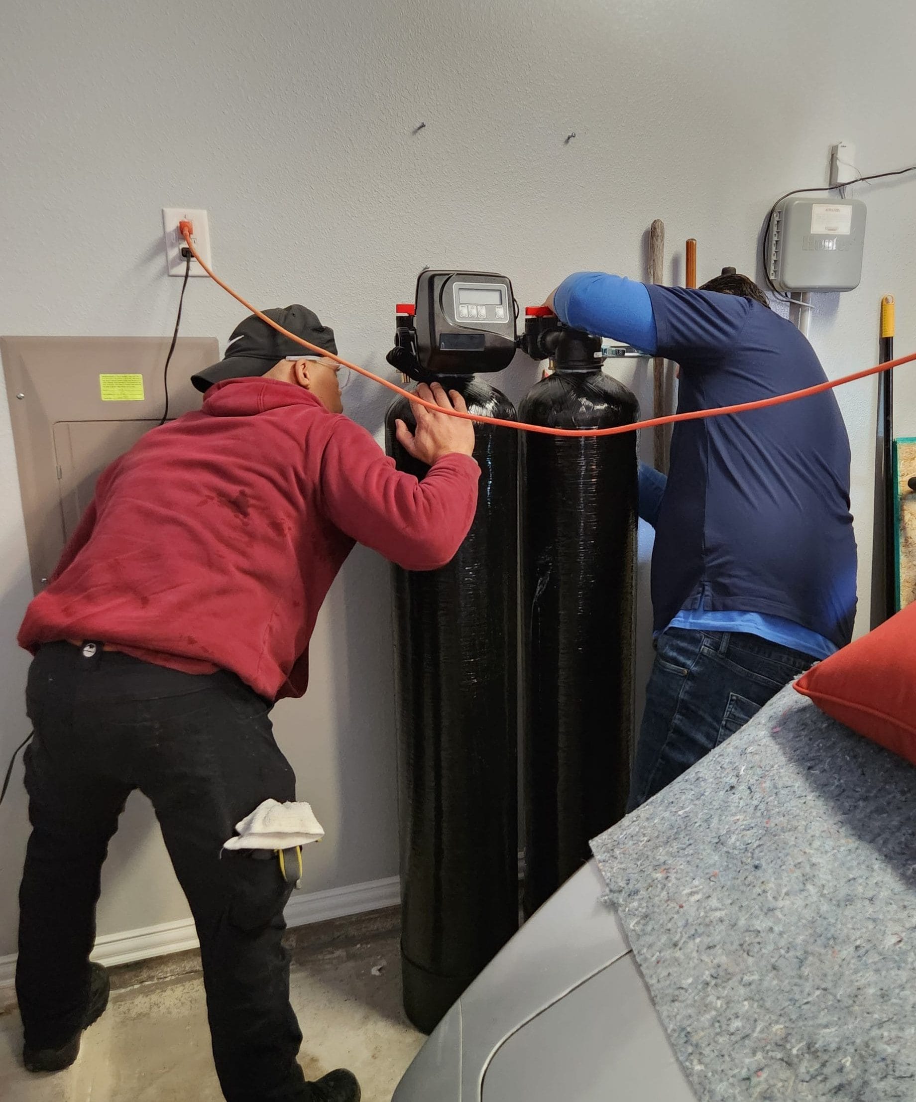 Technicians Performing Water Filtration Repairs
