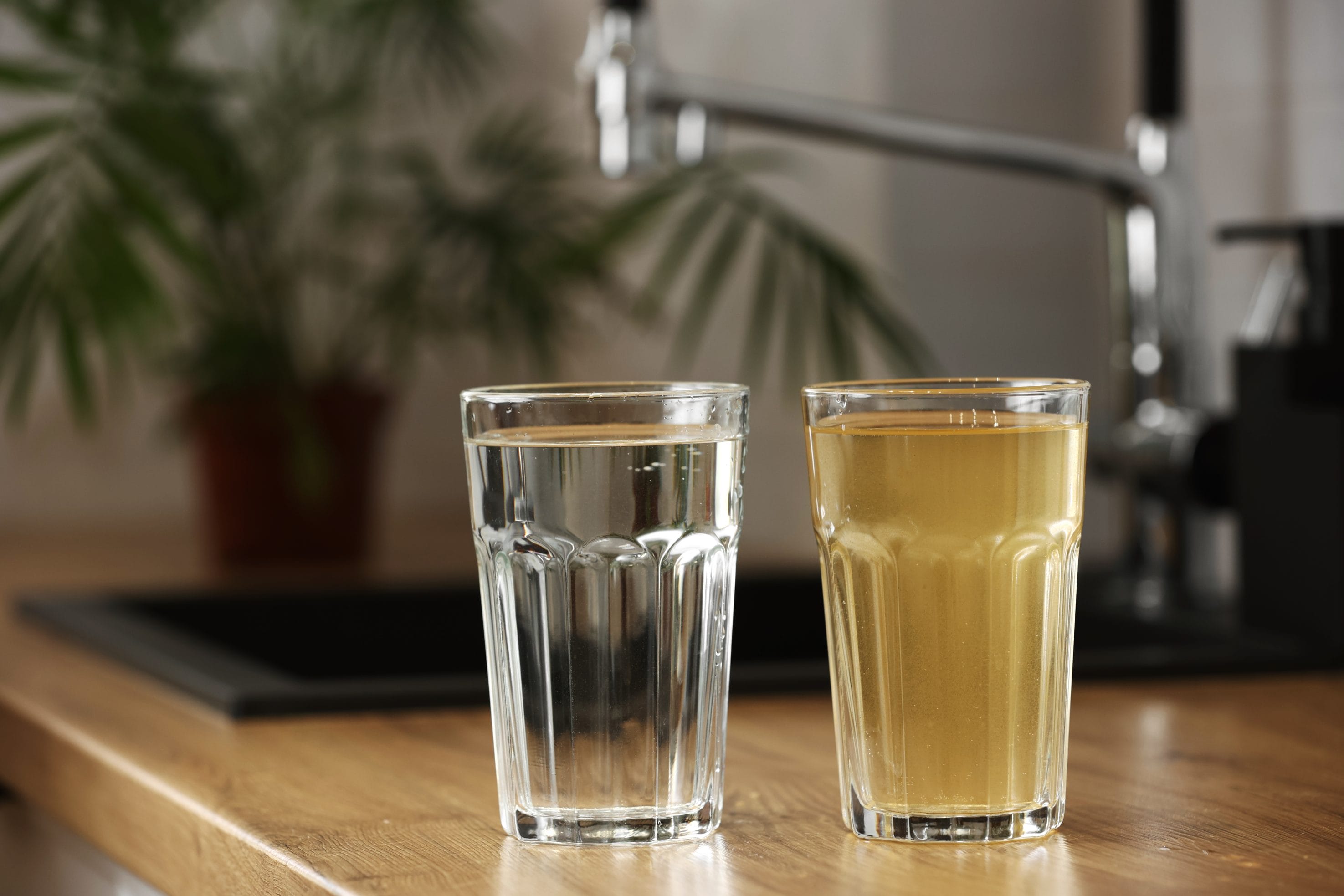 Adobe Stock image of a clear glass of water by a dirty glass of water.